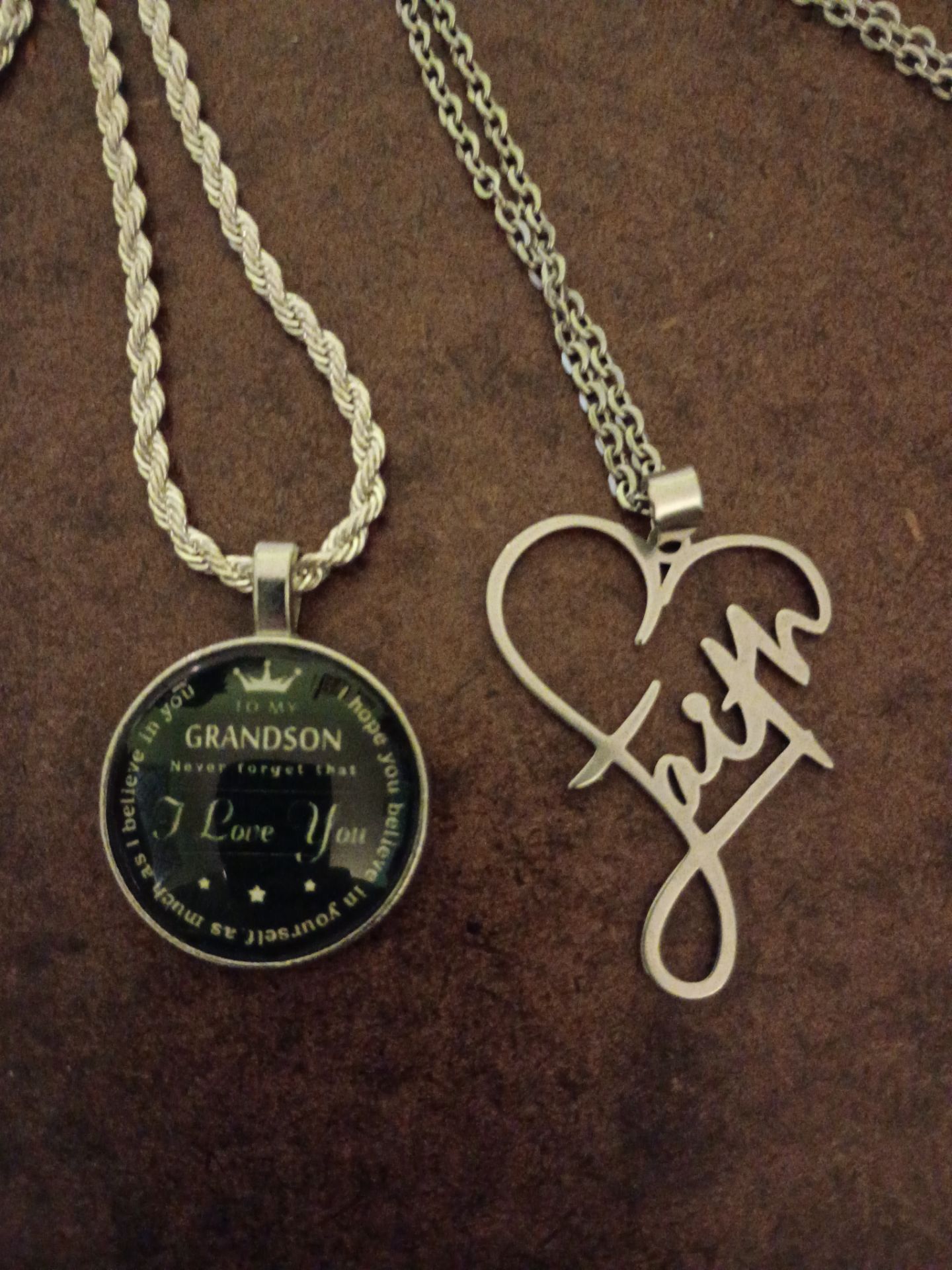 2 necklaces one rope chain with pendant for grandson 1 with a heart with faith written through middle in perfect condition