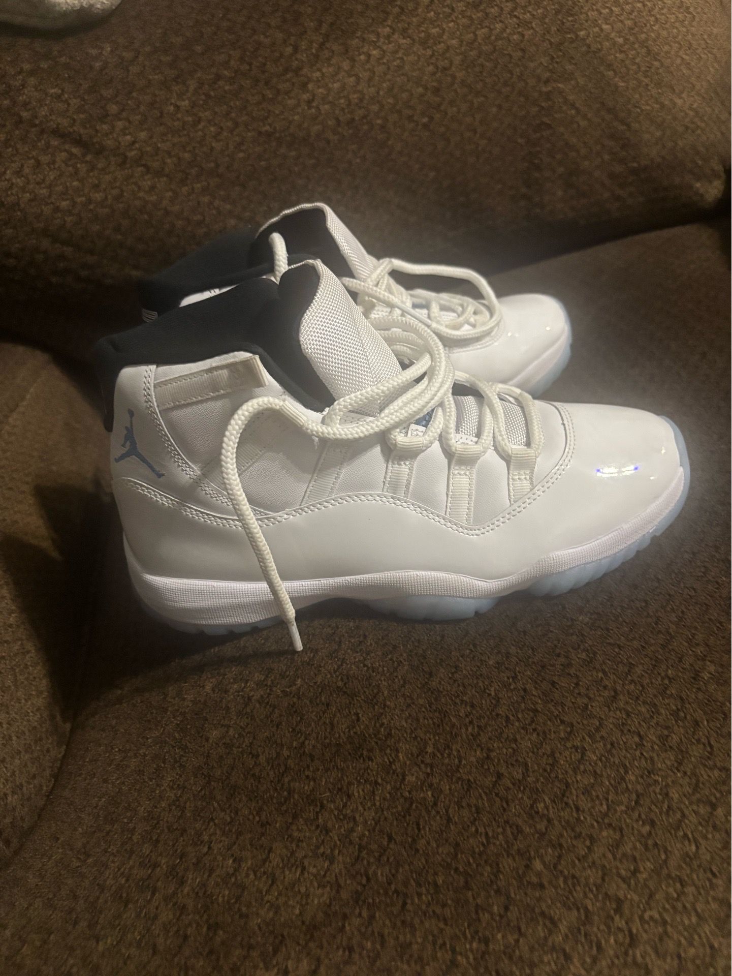 Blue and white Jordan retro 11s