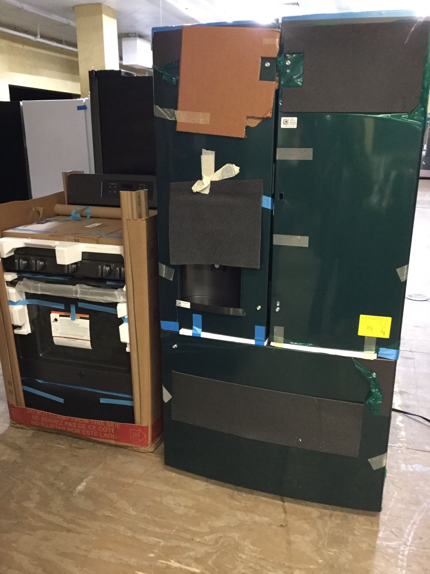 GE Black slate set 36” French Door Refrigerator with showcase and 5 Burner conv Oven Gas Range