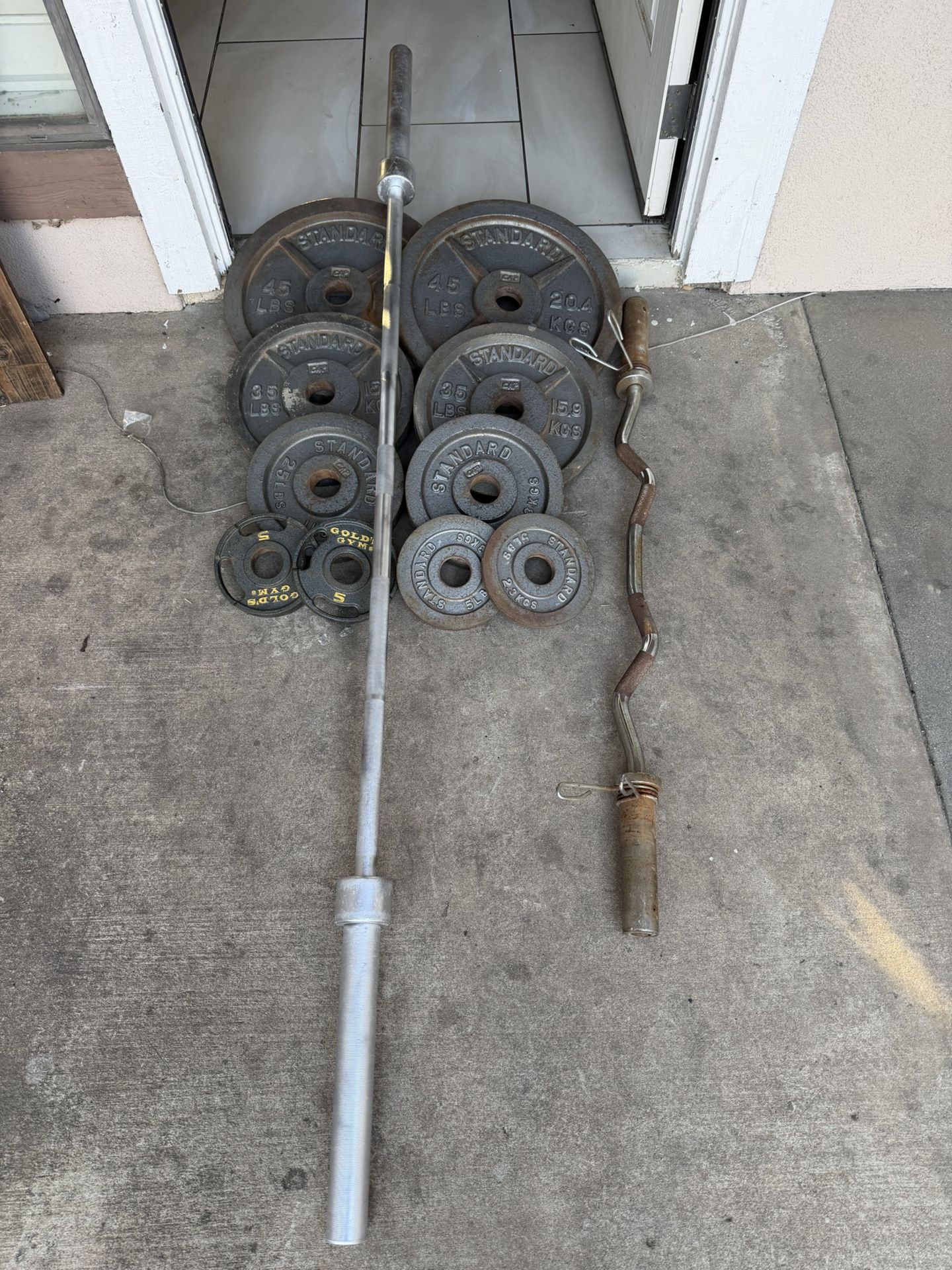 Olympic weights 230lbs total plus curl bar and 7ft 45lbs bar firm price 