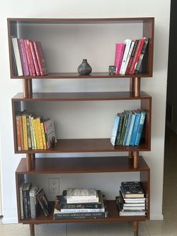 Beautiful solid wood console table with a unique curved design.  Very sturdy and in great condition — perfect for entryway or living space.  Selling b