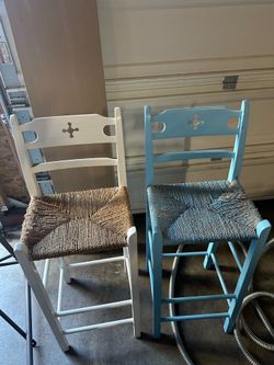 2 ladder back design chairs.