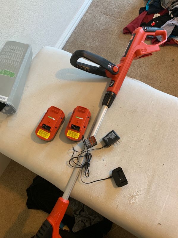 Black and decker weed eater with 2 batteries and a charger for Sale in
