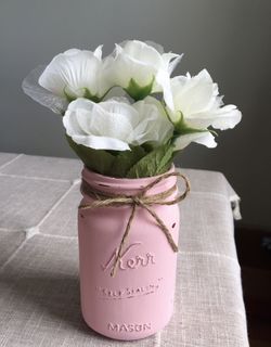 Distressed mason jar vase with silk flowers