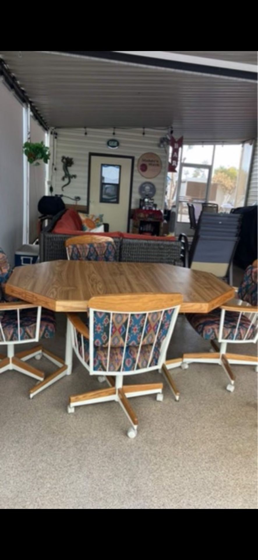Table With Leaf Chairs And Extra Pillows 