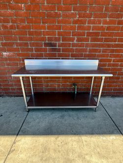 Stainless steel work prep table with back splash 24” x 60” x 31” tall