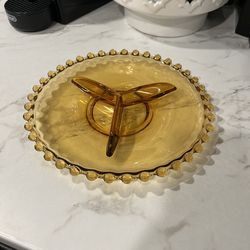 vintage amber glass divided dish featuring a beaded or "hobnail" edge