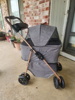 The pet stroller shown is a 3-in-1 multifunctional travel