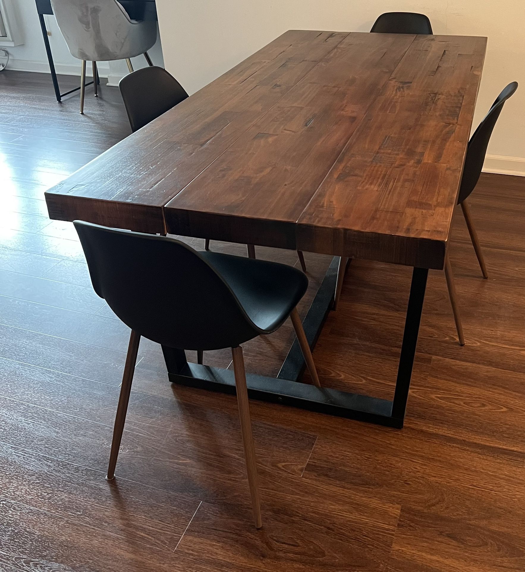 Large wooden dining room table with 4 chairs