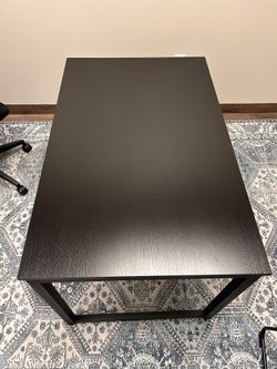 Black wood table 47 1/2 inches long x 30 inches wide x 29 1/2 inches tall.