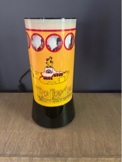 The Beatles Yellow Submarine rotating lamp by Rabbit Tanaka. Measures 13” in height. Still like new.