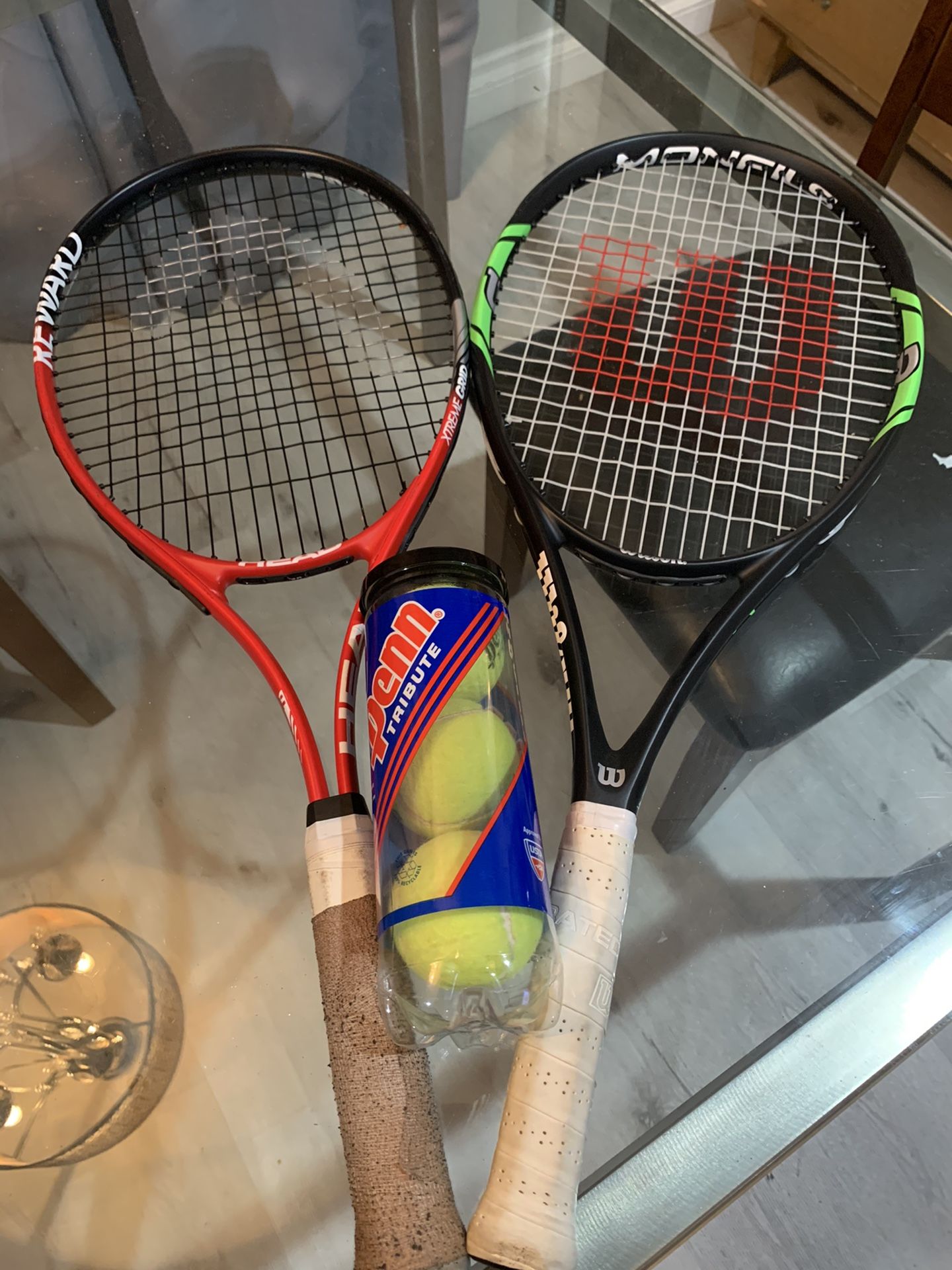 2 tennis rackets and set of balls