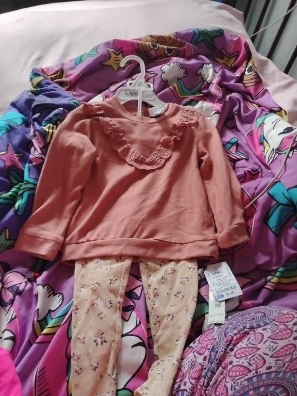 Girls Clothes And Pair Of Boots