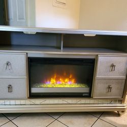 mueble de televicion con chimenea si calienta