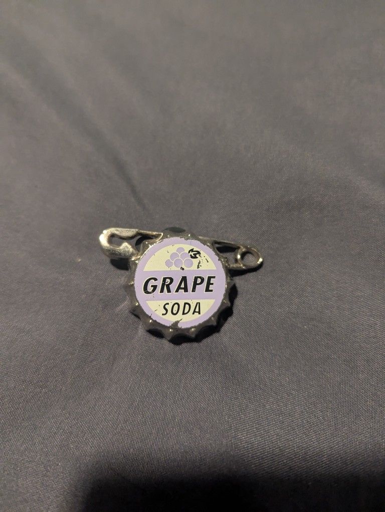 Disney 2010 Pin Trading Pin Ellie's Grape Soda Bottle Cap