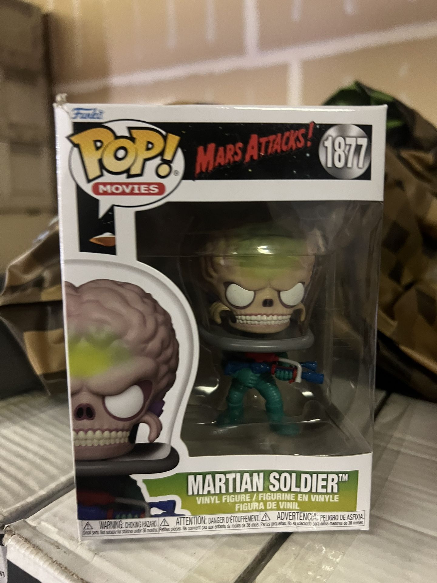 Funko Pop! Movies: Mars Attacks Martian Soldier vinyl figure, specifically number 1877 in the series