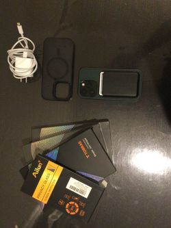 iPhone 14 Pro with Two MagSafe Cases,  Charger and a total of 6 extra screen protectors (including privacy) and MagSafe wallet.