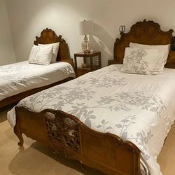 Pair of antique French Louis XV style carved walnut full size beds with nightstand 