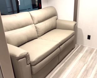 Beige Leather Sofa trifold pull out bed