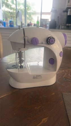 Toy sewing machine ,  never used, $10