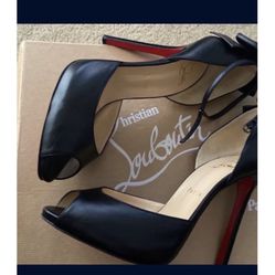 STUNNING CHRISTIAN LOUBOUTIN RED BOTTOM OPEN TOE HEELS IN GOOD CONDITION .