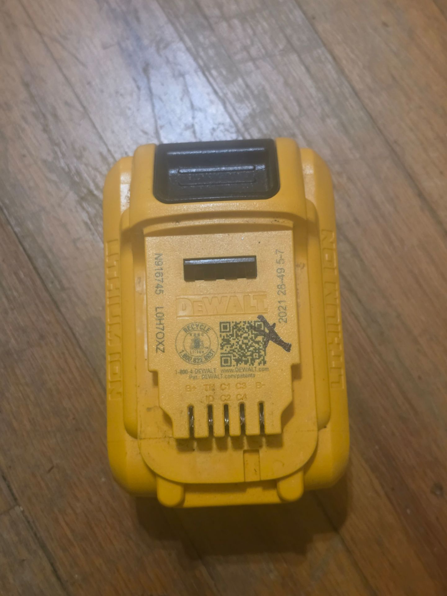 This is a DEWALT 20V MAX Lithium-Ion battery pack, likely a compact model such as the 2.0Ah (DCB203) or a similar 20V series.