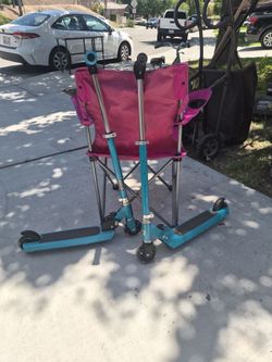 2 blue kid scooters