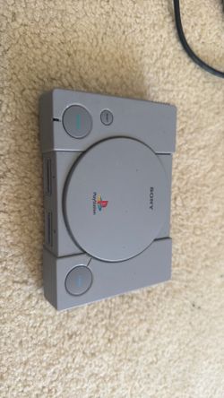 PlayStation Classic mini console with controllers