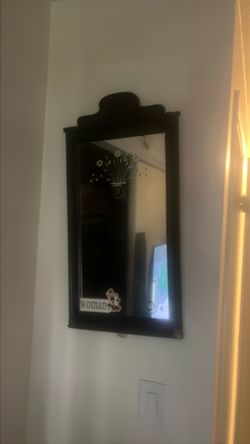 Small black wall mirror