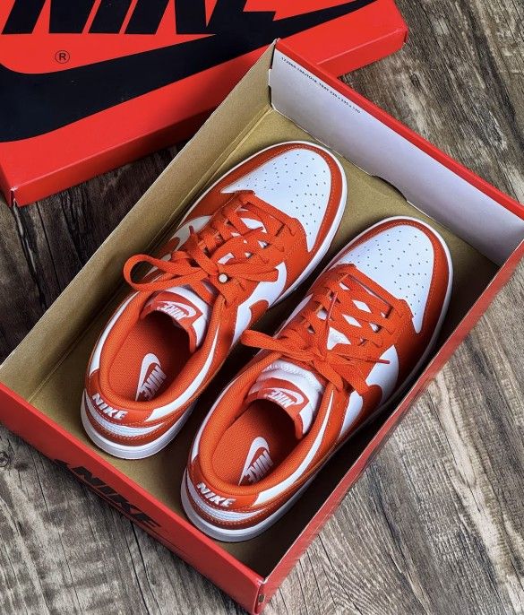 White and orange sports shoes