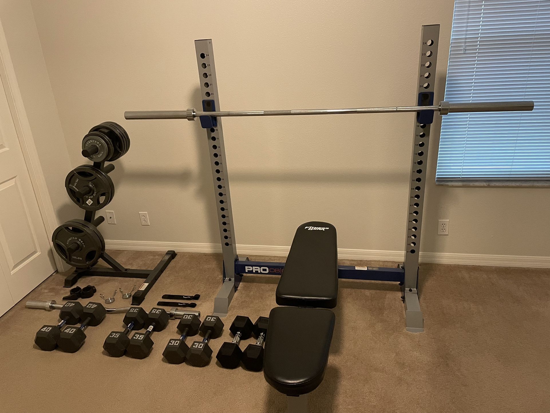 Fitness Gear Olympic weight bench with bars and weights. Like new condition. Everything in the pictures will be included: -Weight Bench (Squat rack o