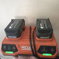  RIDGID 18V Dual Port Simultaneous Charger (Model AC86095) with two attached 18V lithium-ion batteries
