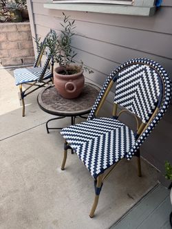 2 bistro chairs and a table