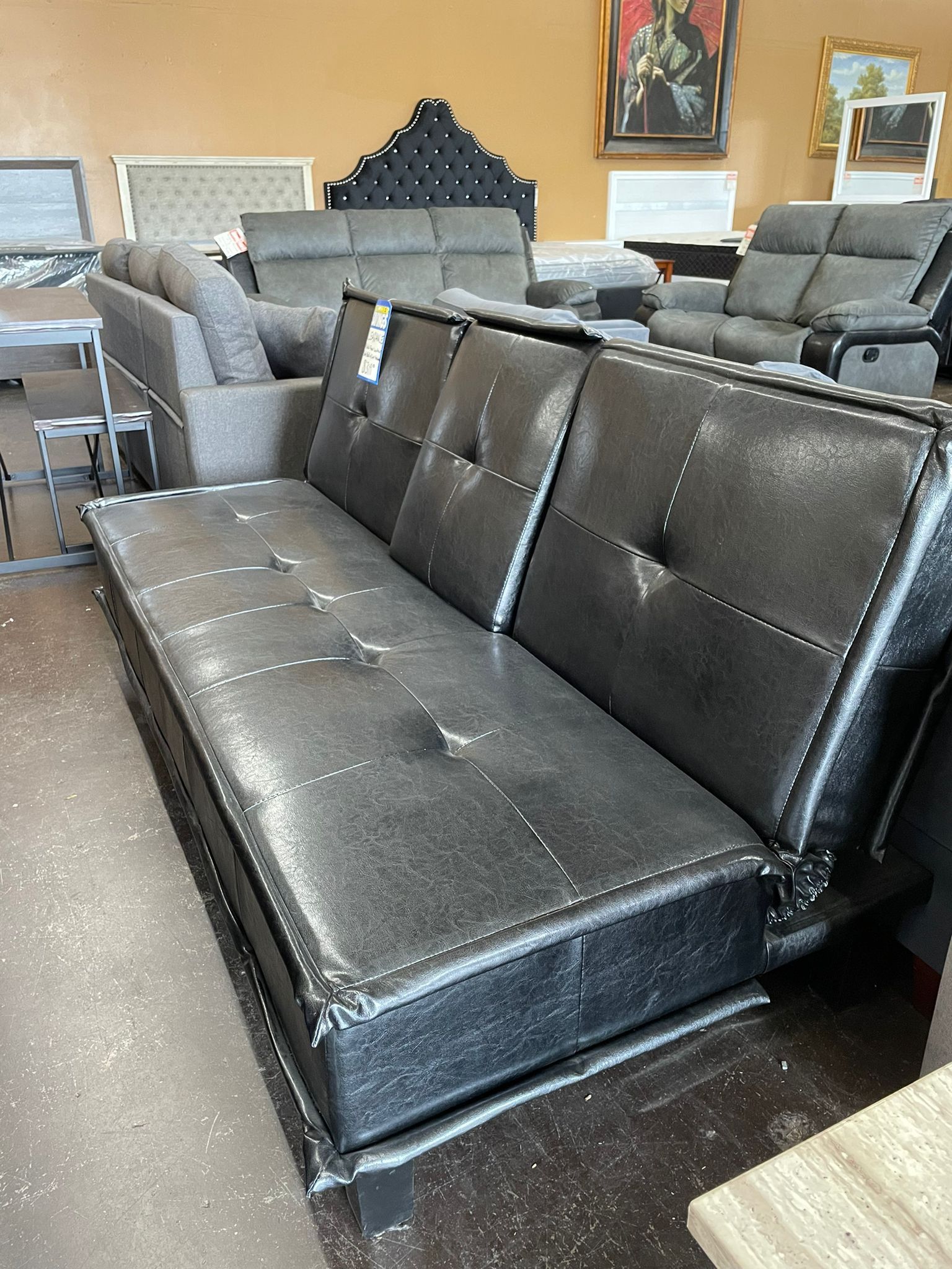 Black Leather Futon with Drop Down Console