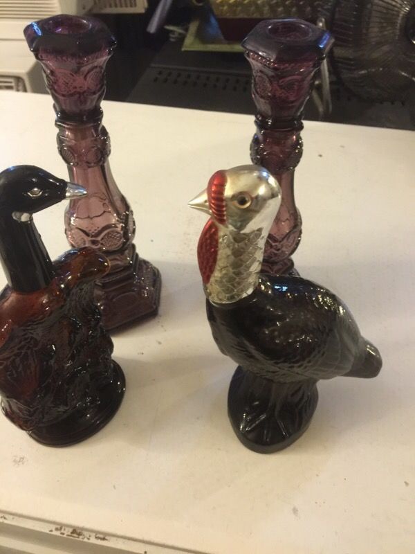 Set of 4 Avon bottles, 2 candles holder, a wild turkey and a windjammer bird, all glass.