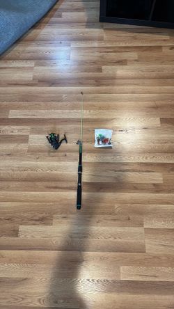 Green foldable fishing rod with spinning reel and 20 piece lure kit with hooks