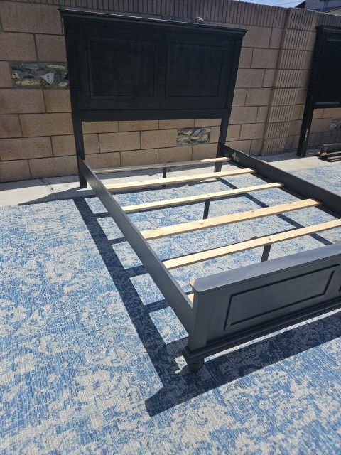 Gray panel bed frame from the Ashley Furniture Lanolee collection