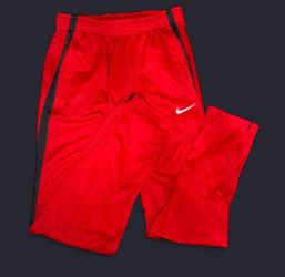 Red Nike Dri-Fit track pants