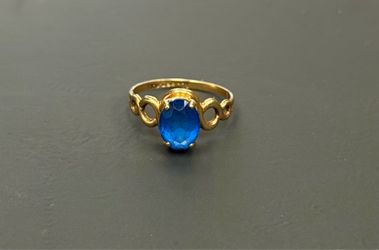 Yellow gold ring blue stone size 3.5  band