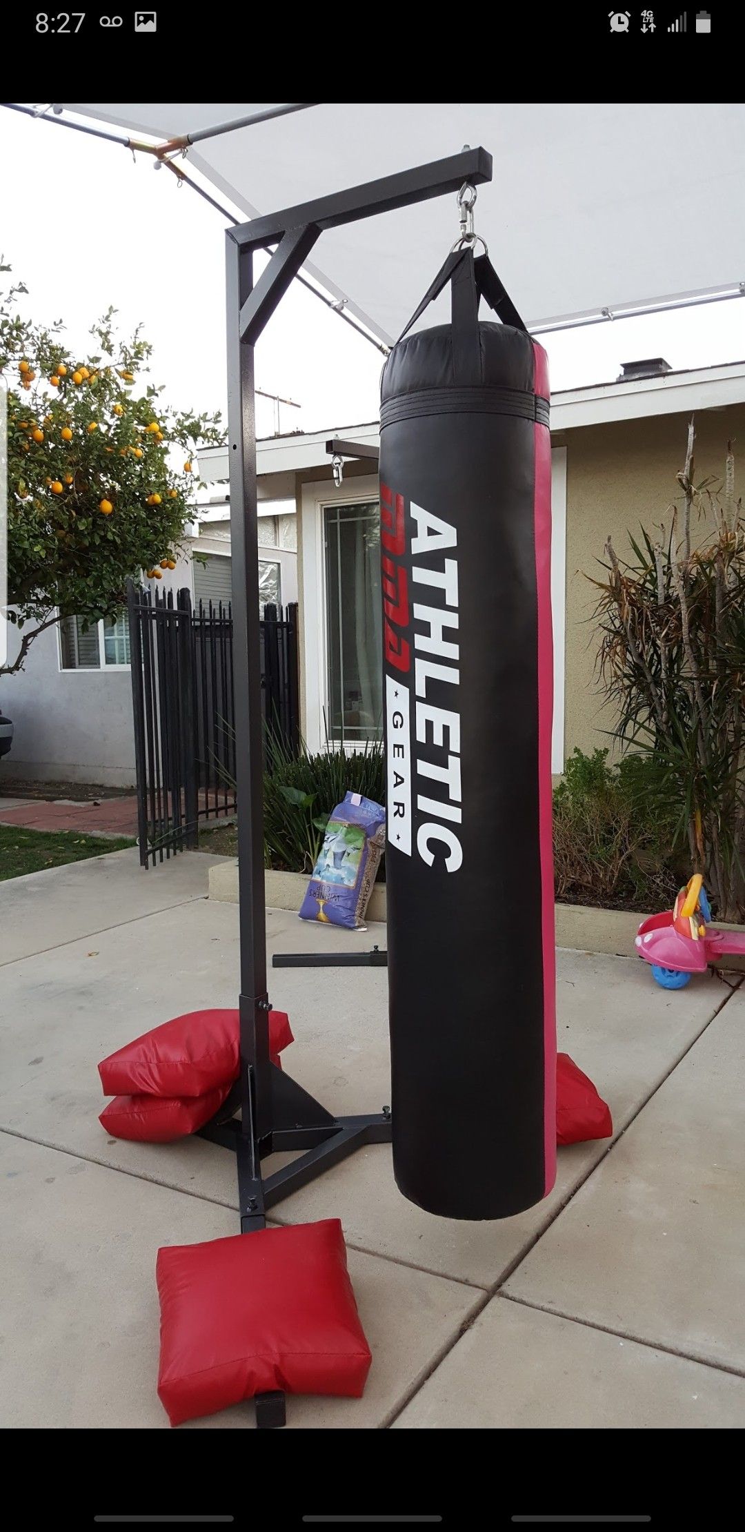 Punching bag stand and heavy bag with 4 weight bags