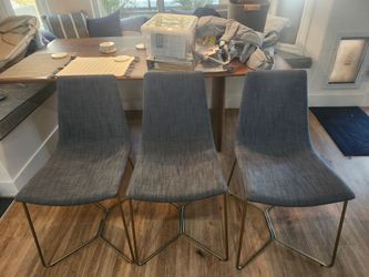 West Elm slope dining chairs with metal legs