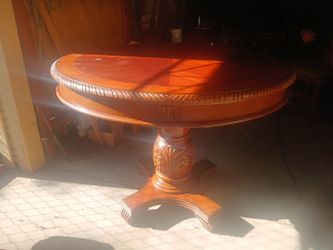 Round Wood Pedestal Table with Carved Detail