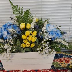 Floral Arrangement In White Basket