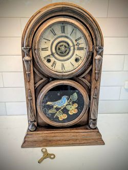 1800s antique wood mantle clock by Ingraham. 150+ year old collectible clock. Seems to run well, but not thoroughly tested. Reverse painted bir