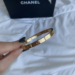 Cartier love bracelet w/ yellow gold, size 18.