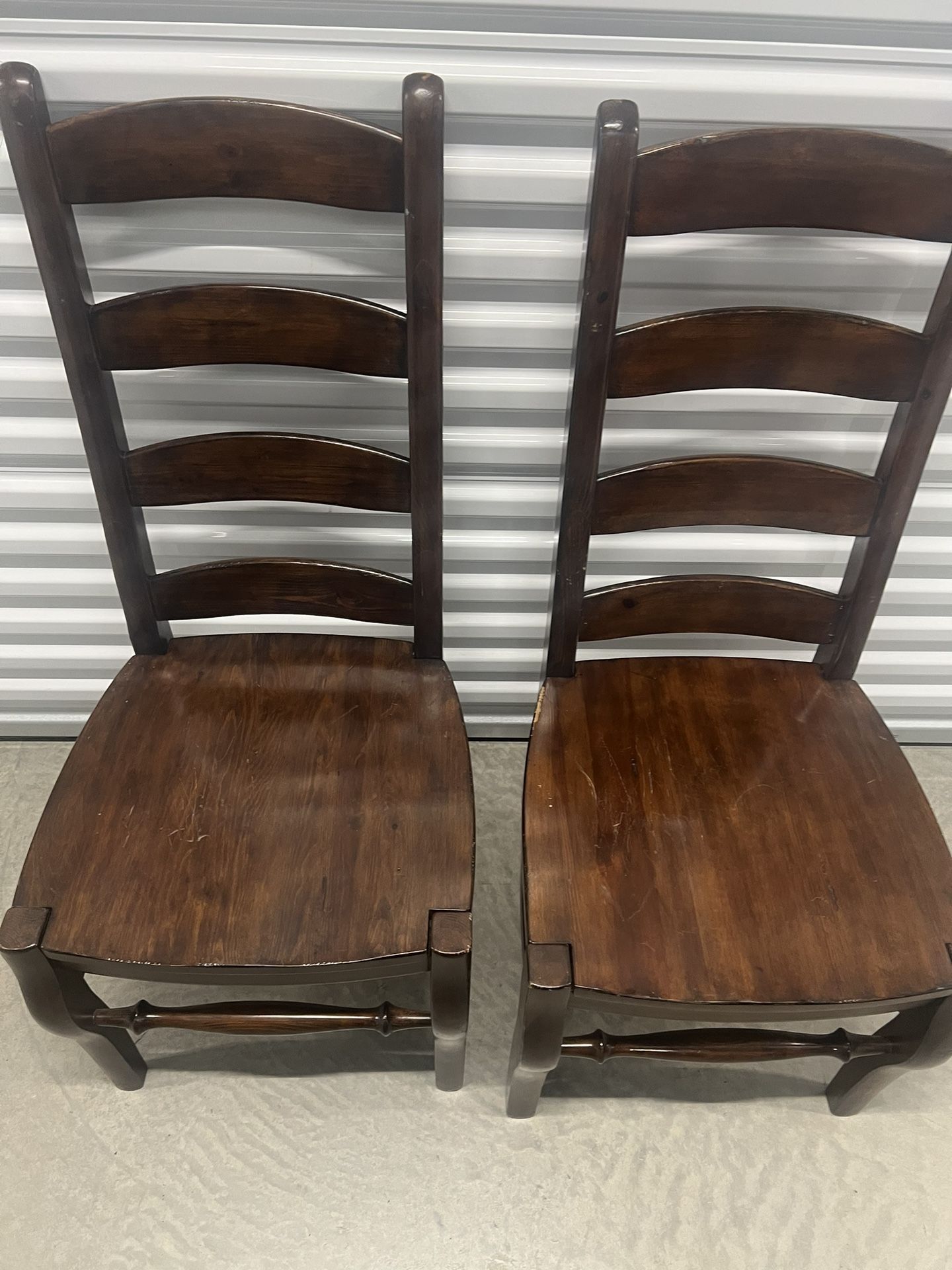 Lot of 2 Pottery Barn Wynn Ladderback Chestnut Dining Chairs. Used in good condition with cosmetic blemishes associated with normal usage. These blemi