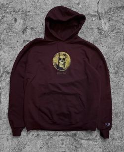 Burgundy Champion primitive hoodie with yellow skull graphic