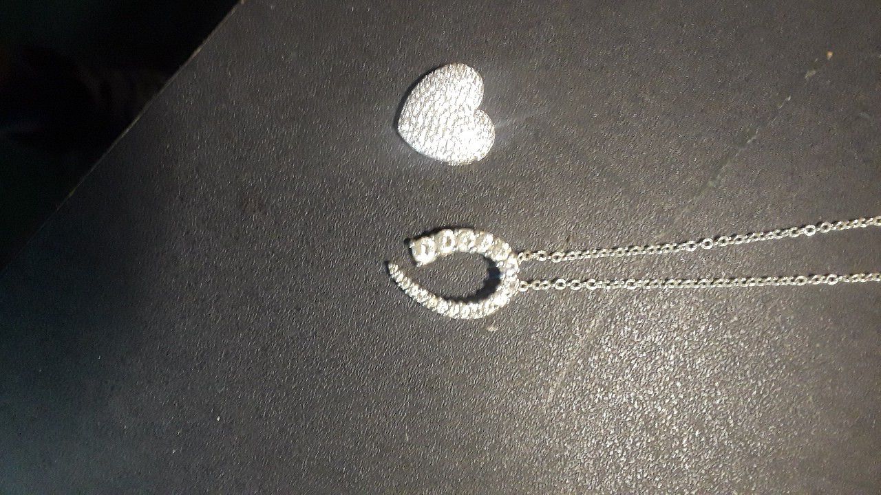 2 diamond charms and a necklace silver