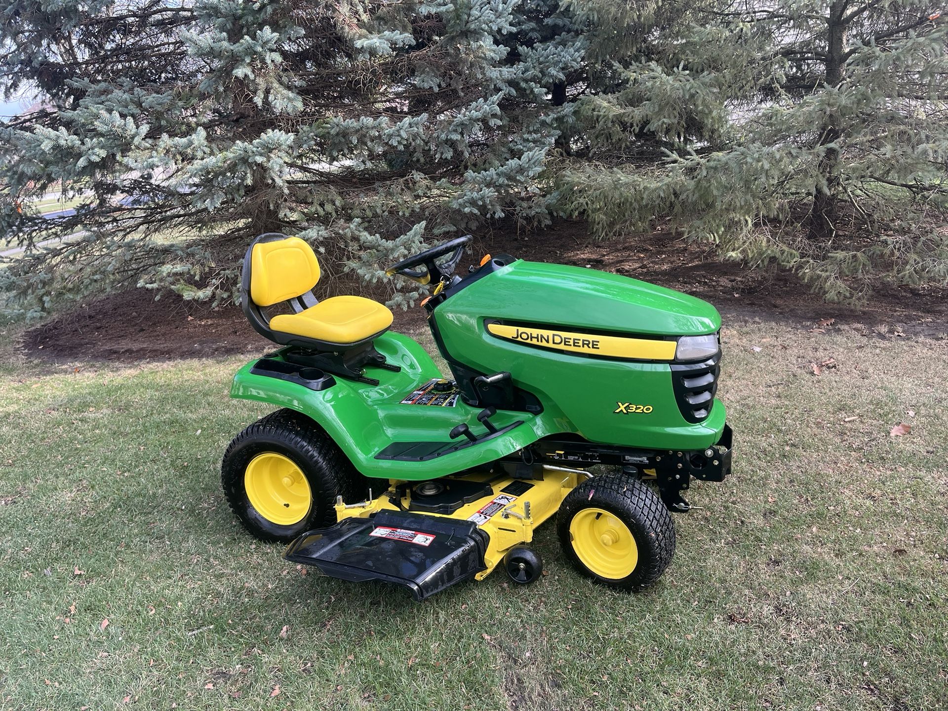 John Deere X320 Garden Tractor With A 48 Inch Deck And Power Bagger for