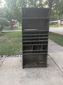 Metal shelving unit with lots of compartments